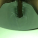From under the toilet, a very cute girl pushes out a log that hangs and drops, with the product in the bowl. Filmed from a between the legs perspective. Vertical format video. Almost a minute and a half.